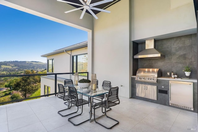 view of patio / terrace with a balcony, ceiling fan, visible vents, and area for grilling