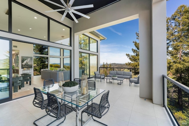 view of patio / terrace with a ceiling fan and an outdoor hangout area