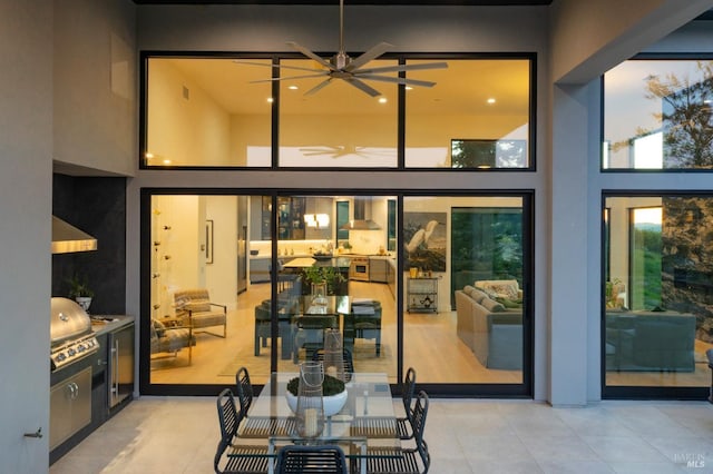 view of patio with area for grilling and ceiling fan
