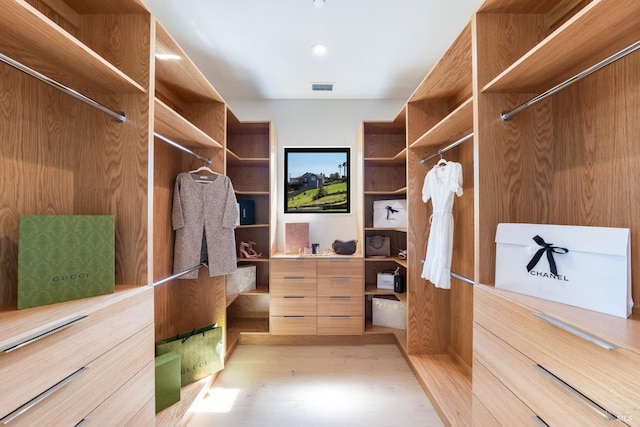 spacious closet with visible vents and light wood-type flooring