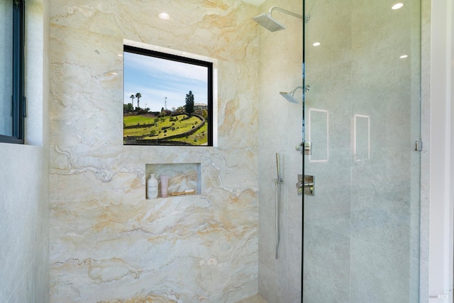 bathroom with tiled shower