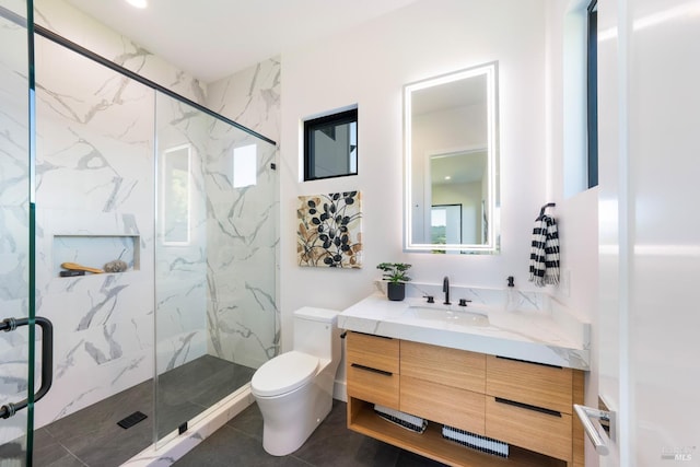 full bathroom featuring a marble finish shower, toilet, and vanity