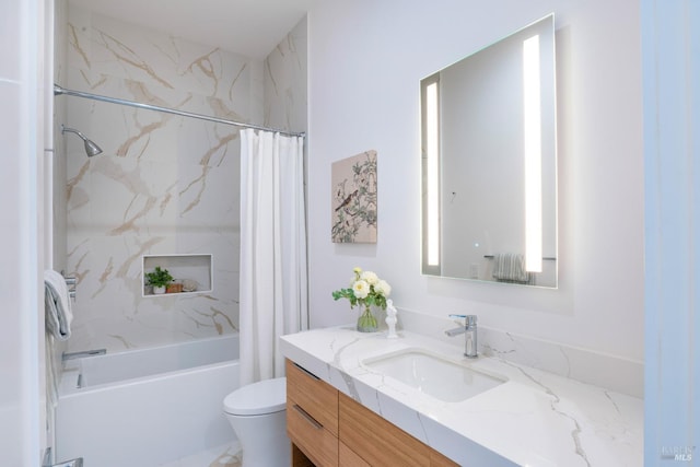 full bathroom with toilet, vanity, and shower / bath combo with shower curtain