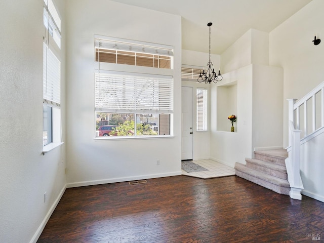 2085 Banjo Dr, Santa Rosa, CA 95407 - entrance foyer with baseboards, a notable chandelier, wood finished floors, and stairway