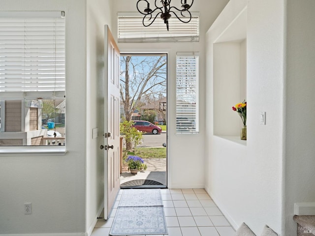 2085 Banjo Dr, Santa Rosa, CA 95407 - entrance foyer featuring light tile patterned flooring, baseboards, and a notable chandelier