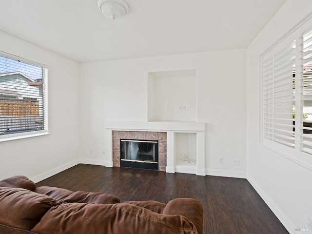 2085 Banjo Dr, Santa Rosa, CA 95407 - living area with baseboards, a tiled fireplace, and wood finished floors