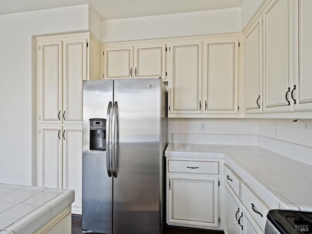 2085 Banjo Dr, Santa Rosa, CA 95407 - kitchen with cream cabinets, stainless steel fridge with ice dispenser, tile countertops, and electric range oven
