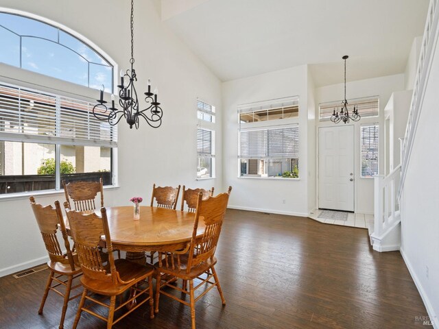 2085 Banjo Dr, Santa Rosa, CA 95407 - dining space featuring baseboards, a high ceiling, visible vents, a notable chandelier, and wood finished floors