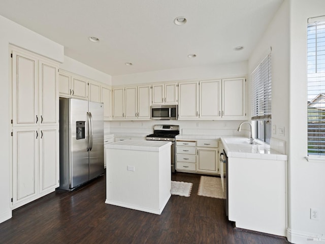 2085 Banjo Dr, Santa Rosa, CA 95407 - kitchen with a sink, a center island, appliances with stainless steel finishes, and dark wood-type flooring