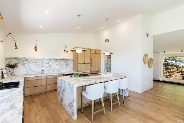 559 E Spring St, Napa, CA 94559 - kitchen featuring a sink, decorative backsplash, a center island, modern cabinets, and light wood-style floors