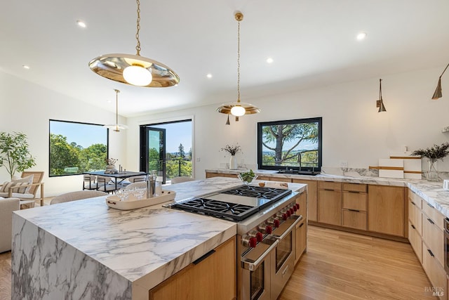 559 E Spring St, Napa, CA 94559 - kitchen featuring light brown cabinets, double oven range, recessed lighting, a center island, and light wood-style floors