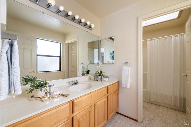 bathroom with shower / bath combination with curtain and vanity