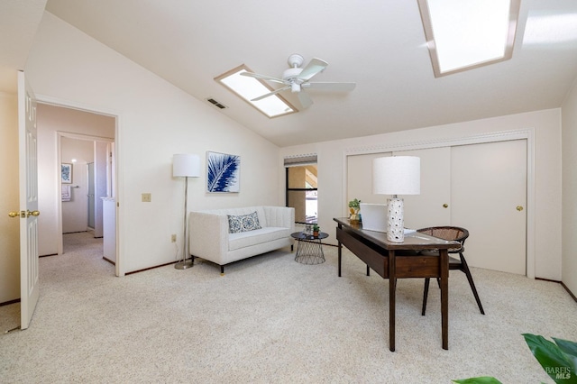 office with light colored carpet, visible vents, lofted ceiling, and a ceiling fan