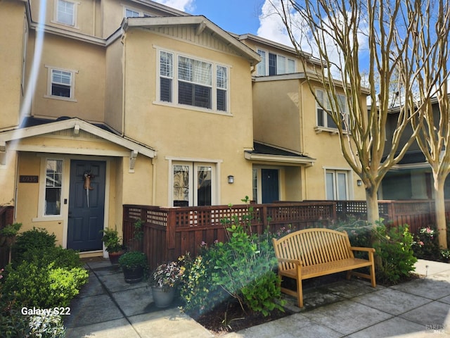 surrounding community featuring a lawn and fence