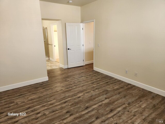 stairs featuring wood finished floors and baseboards