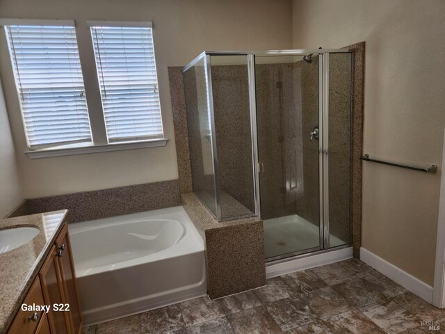 clothes washing area with washer and dryer, cabinet space, and tile patterned floors