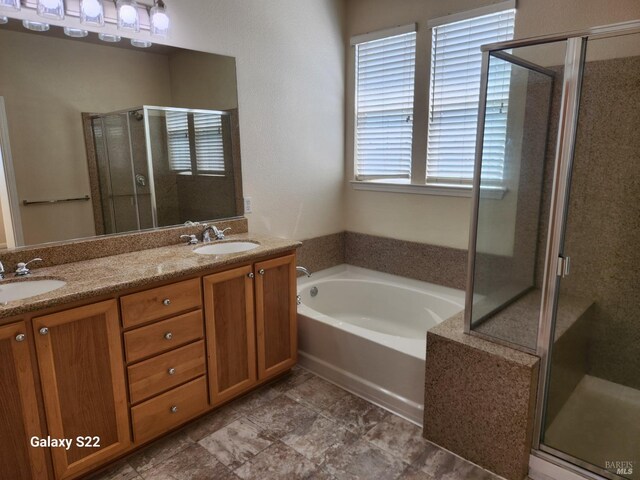 clothes washing area featuring dark wood finished floors, washing machine and clothes dryer, cabinet space, and visible vents