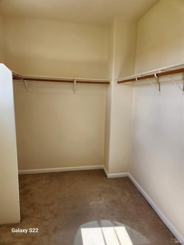 empty room with dark wood finished floors and baseboards