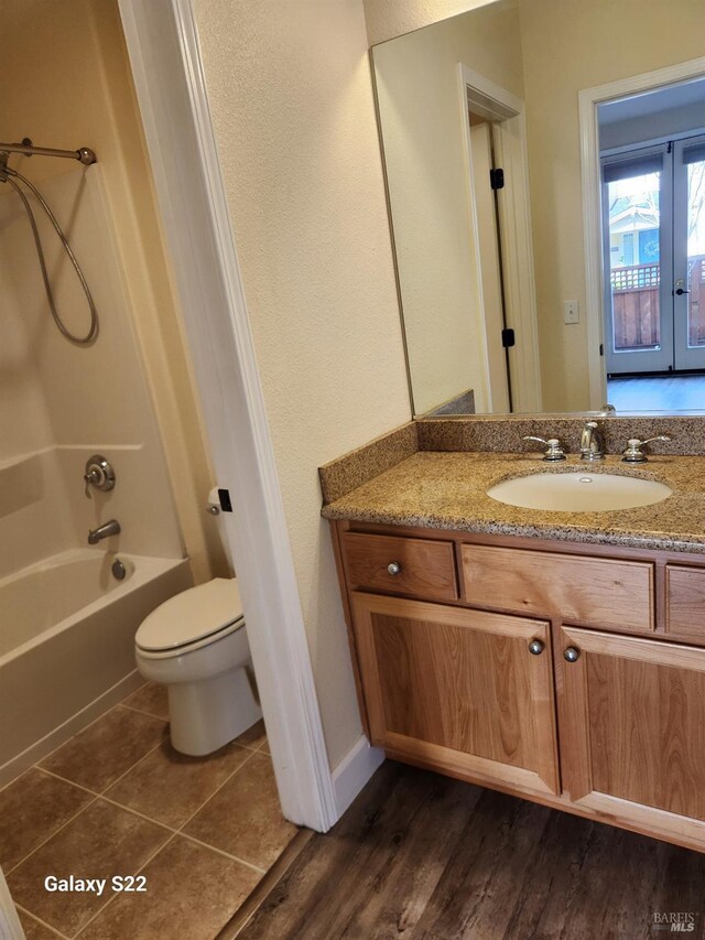 full bath featuring a garden tub, vanity, and a stall shower