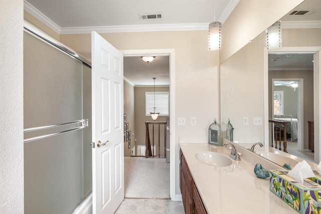 bathroom featuring visible vents, vanity, and ornamental molding