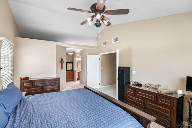 bedroom featuring light carpet, ensuite bath, ceiling fan, and visible vents