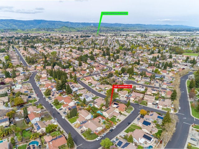 drone / aerial view featuring a mountain view and a residential view