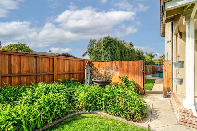 view of yard with a patio and a fenced backyard