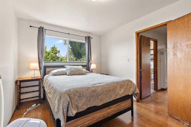 bedroom featuring wood finished floors