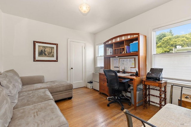 home office featuring light wood-style floors