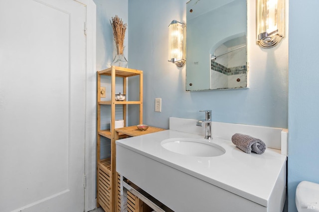 full bath with toilet and vanity