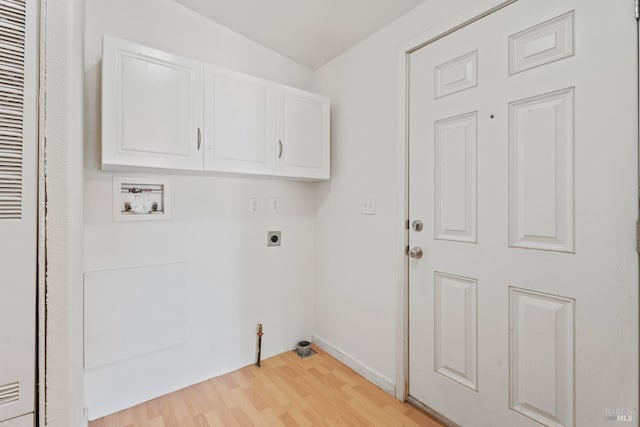 laundry room featuring baseboards, light wood-style floors, cabinet space, a heating unit, and hookup for a washing machine
