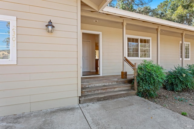 entrance to property featuring a porch