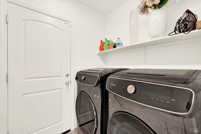 laundry room with separate washer and dryer and laundry area