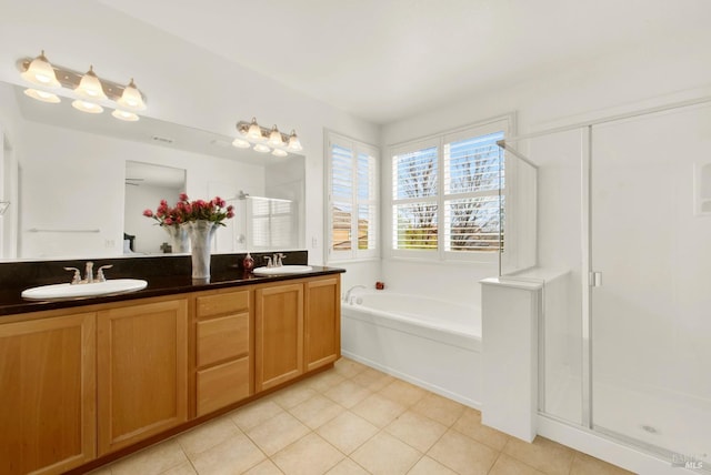 bathroom featuring a sink, a garden tub, a shower stall, tile patterned flooring, and double vanity