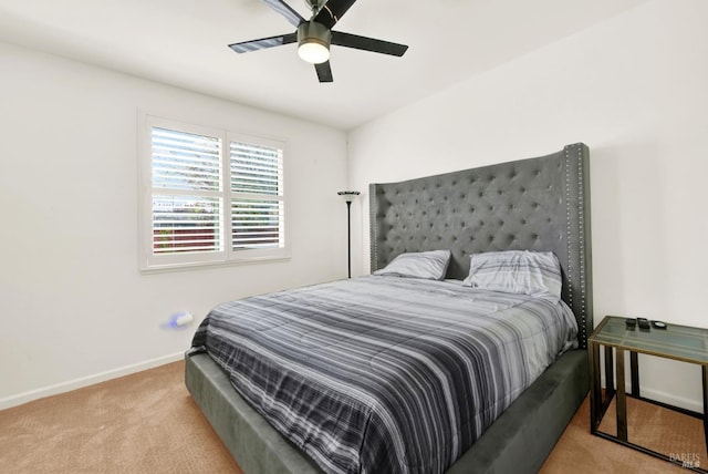 bedroom with carpet flooring, a ceiling fan, and baseboards
