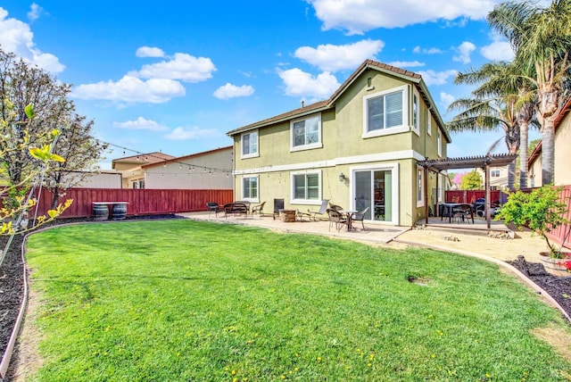 rear view of house with a patio, a fenced backyard, a lawn, stucco siding, and a pergola