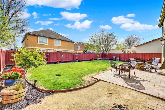 view of yard with a patio and a fenced backyard