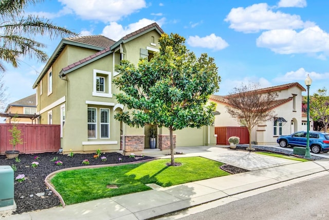 view of front facade featuring driveway, stucco siding, fence, a tiled roof, and a garage
