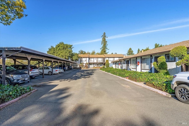 covered parking lot with a residential view