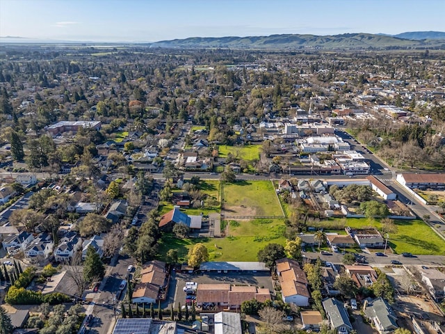drone / aerial view featuring a residential view and a mountain view