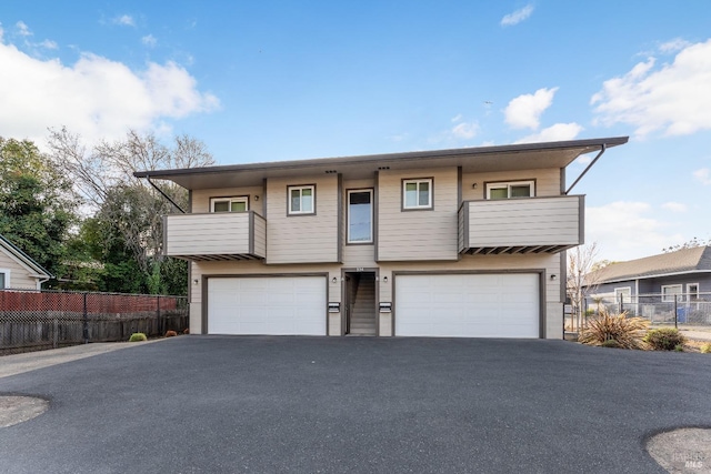 334 N Main St, Ukiah, CA 95482 - multi unit property with a balcony, an attached garage, fence, and aphalt driveway