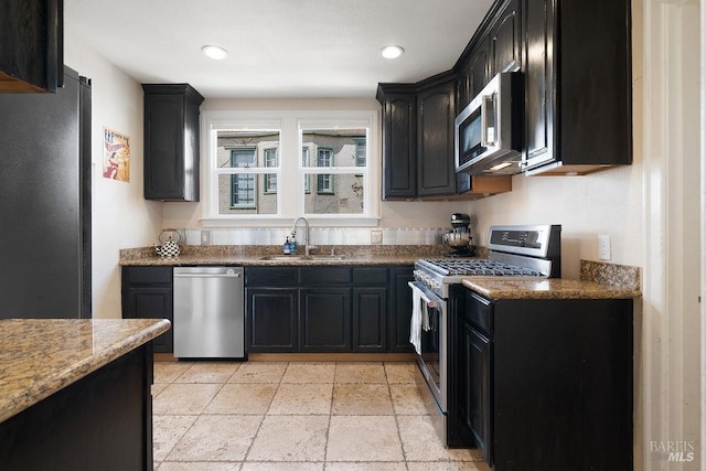 30 Buena Vista Ave, Vallejo, CA 94590 - kitchen with appliances with stainless steel finishes, a sink, dark cabinetry, stone countertops, and recessed lighting