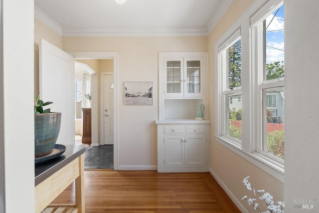 30 Buena Vista Ave, Vallejo, CA 94590 - hallway featuring light wood-type flooring, plenty of natural light, crown molding, baseboards, and arched walkways