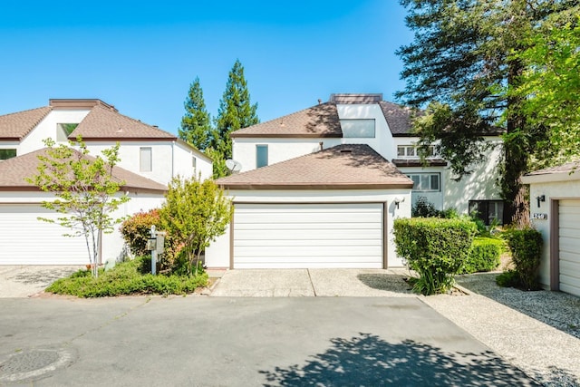 view of front of property featuring a garage and stucco siding
