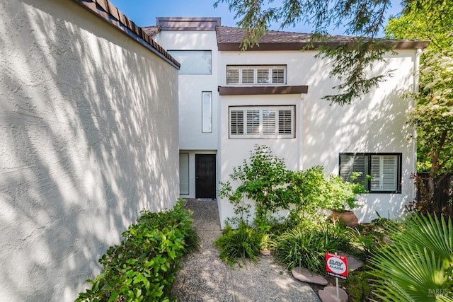 exterior space with stucco siding
