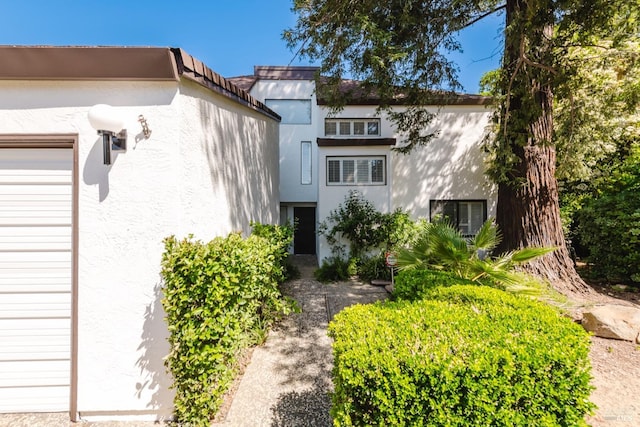 exterior space featuring stucco siding