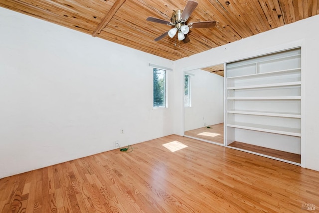 unfurnished bedroom featuring ceiling fan, wood ceiling, and wood finished floors