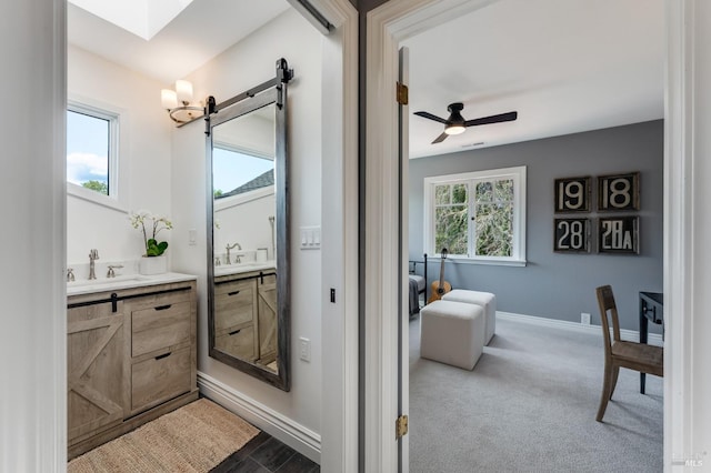 4071 Bones Rd, Sebastopol, CA 95472 - bedroom featuring a skylight, vaulted ceiling, light colored carpet, a closet, and baseboards