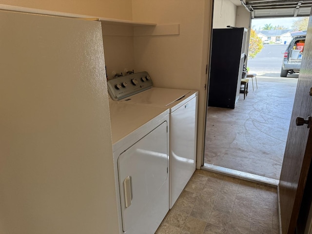 clothes washing area with laundry area and washing machine and dryer