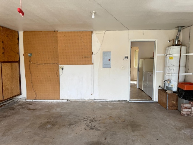 garage with washer / clothes dryer, water heater, and electric panel